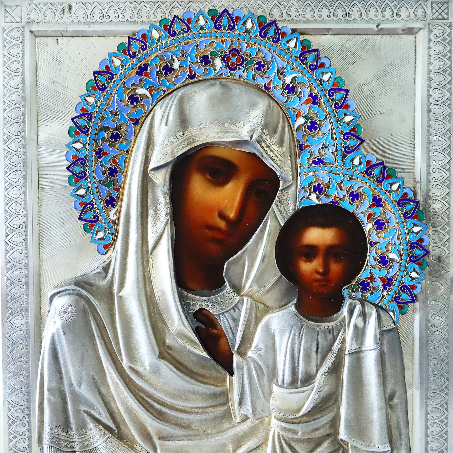 Antiques, Orthodox, Russian icon: KAZAN MOTHER OF GOD WITH A SILVER-GILT OKLAD WITH ENAMEL HALO. | 5348 |