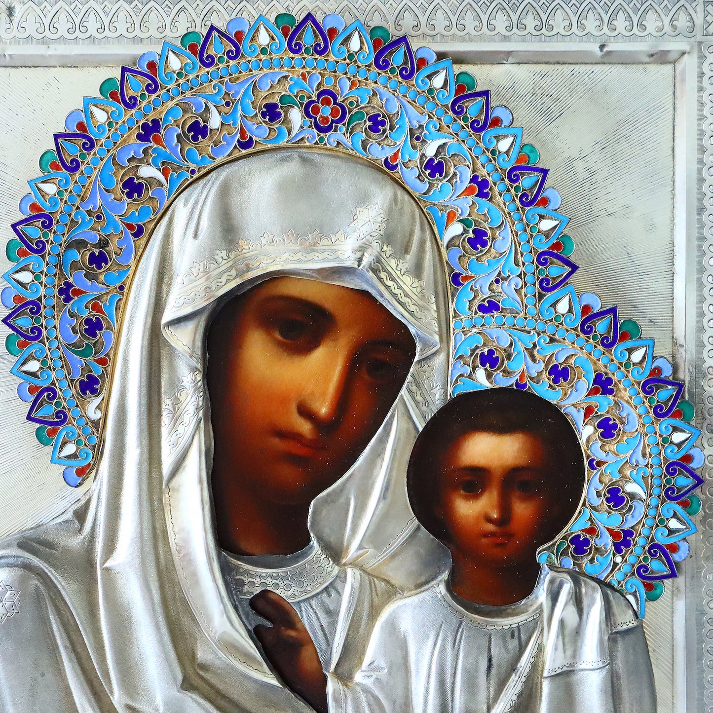 Antiques, Orthodox, Russian icon: KAZAN MOTHER OF GOD WITH A SILVER-GILT OKLAD WITH ENAMEL HALO. | 5348 |