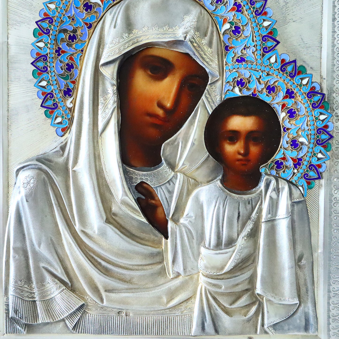 Antiques, Orthodox, Russian icon: KAZAN MOTHER OF GOD WITH A SILVER-GILT OKLAD WITH ENAMEL HALO. | 5348 |